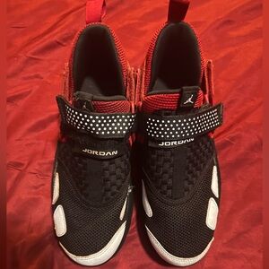 Gentle worn red and blk Jordan. Boys size 6.